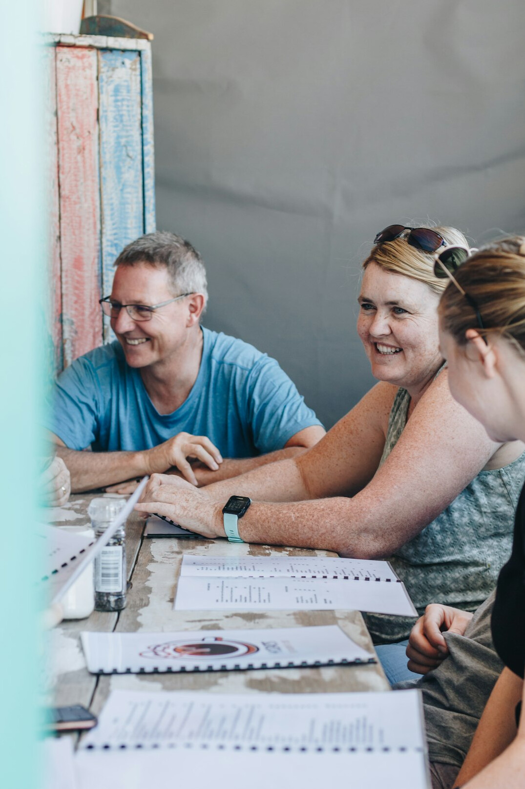 family sitting at table with budget papers