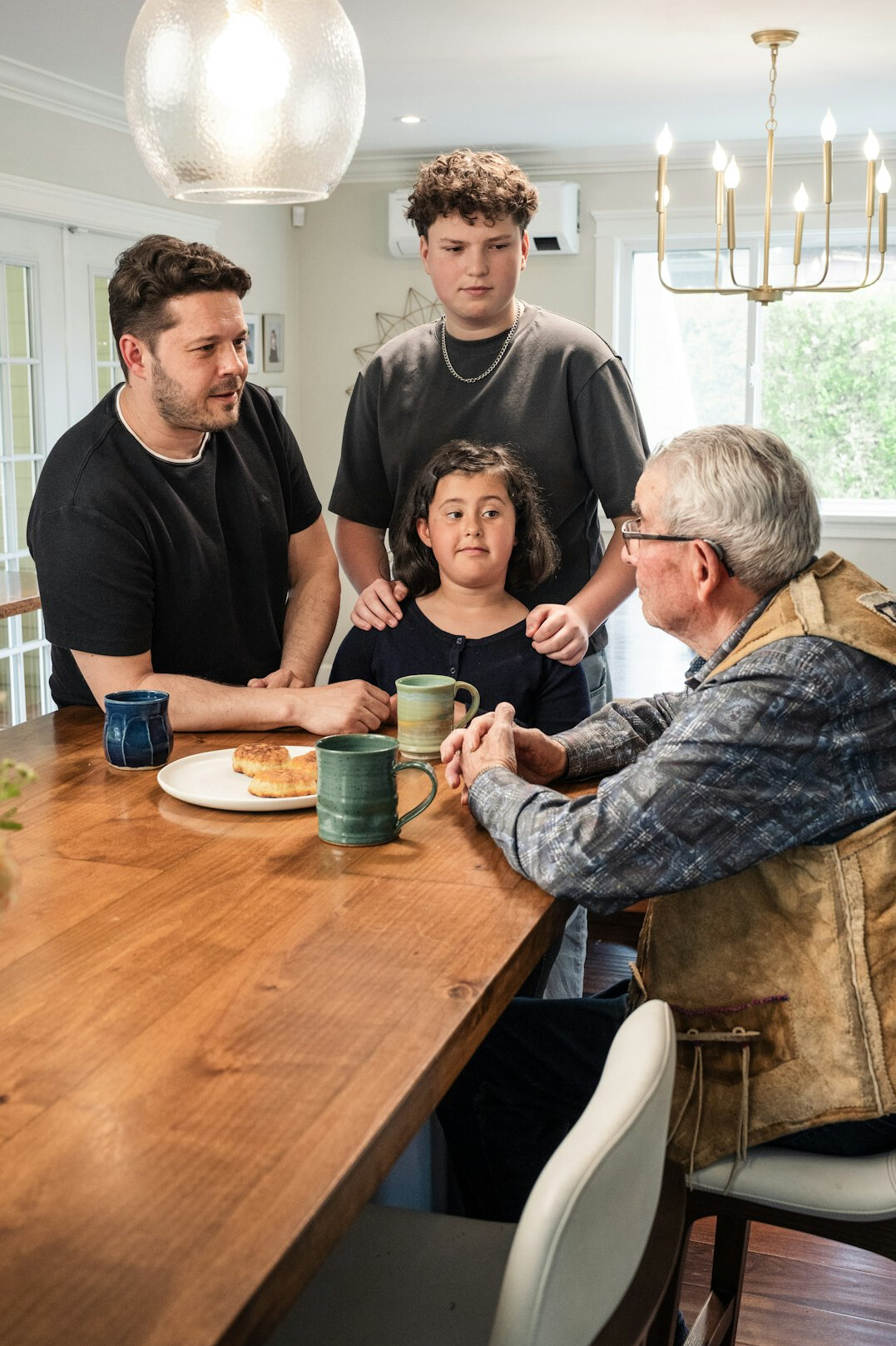 family creating budget at kitchen table