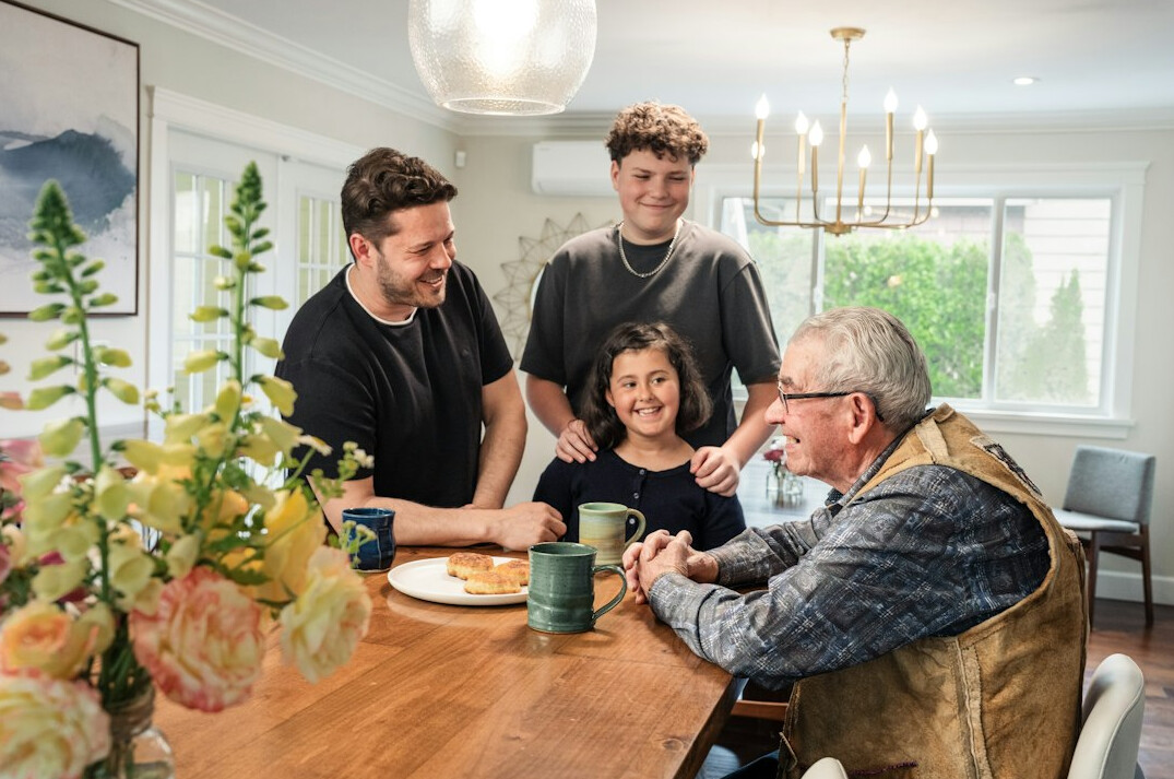 family sitting at table with budget papers