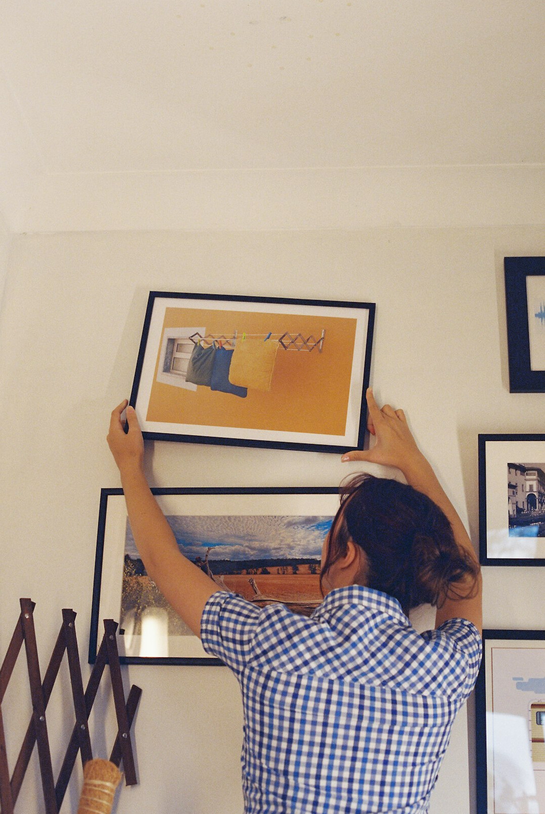 Mature Latin American man organizing documents and folders at a dining table